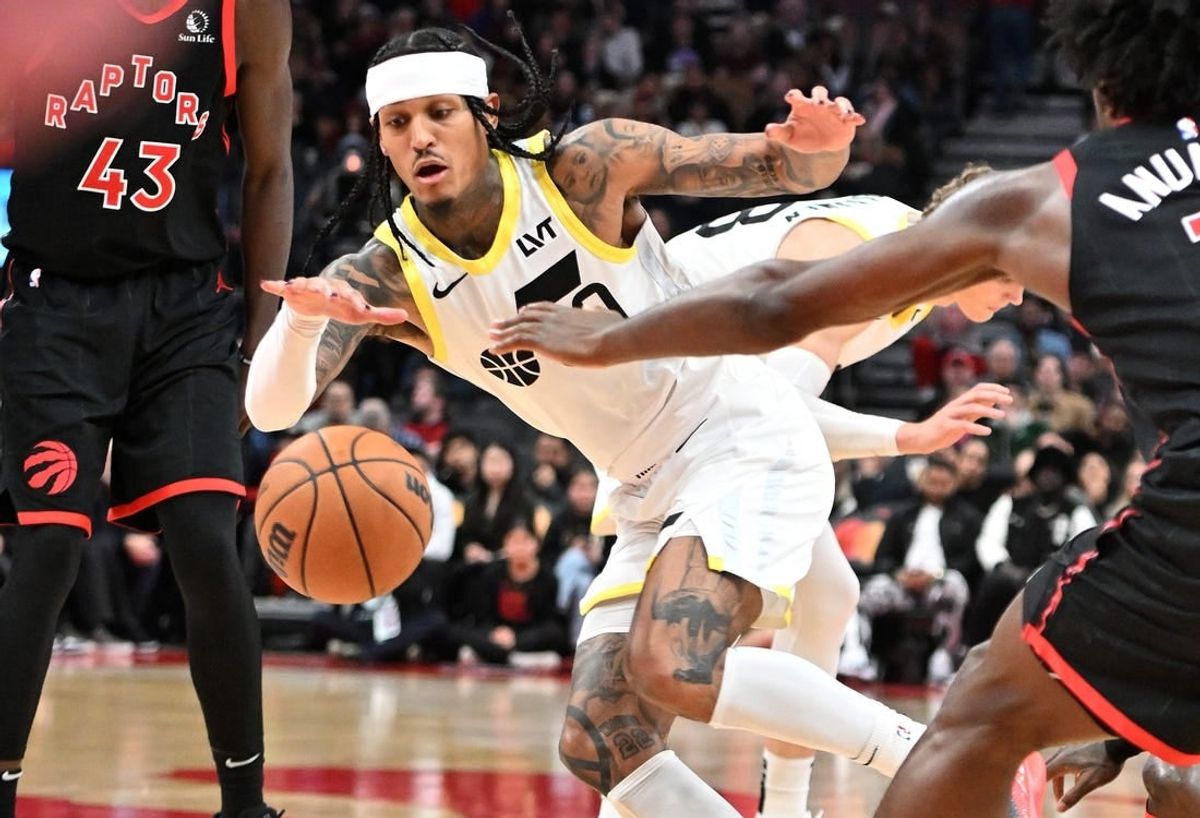 Dec 23, 2023; Toronto, Ontario, CAN;  Utah Jazz guard Jordan Clarkson (00) pursues a loose ball against the Toronto Raptors in the second half at Scotiabank Arena.