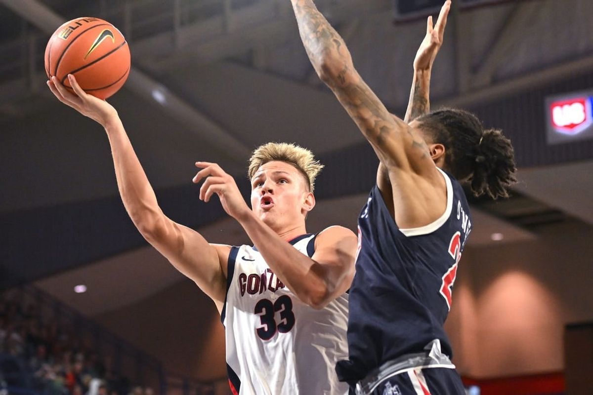 Dec 20, 2023; Spokane, Washington, USA; Gonzaga Bulldogs forward Ben Gregg (33) shoots the ball against Jackson State Tigers forward Jordan O'Neal (23) in the first half at McCarthey Athletic Center.