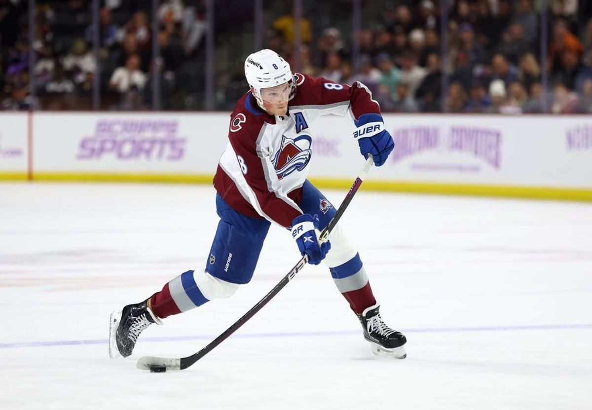 Nov 30, 2023; Tempe, Arizona, USA; Colorado Avalanche defenseman Cale Makar (8) shoots the puck against the Arizona Coyotes in the first period at Mullett Arena.