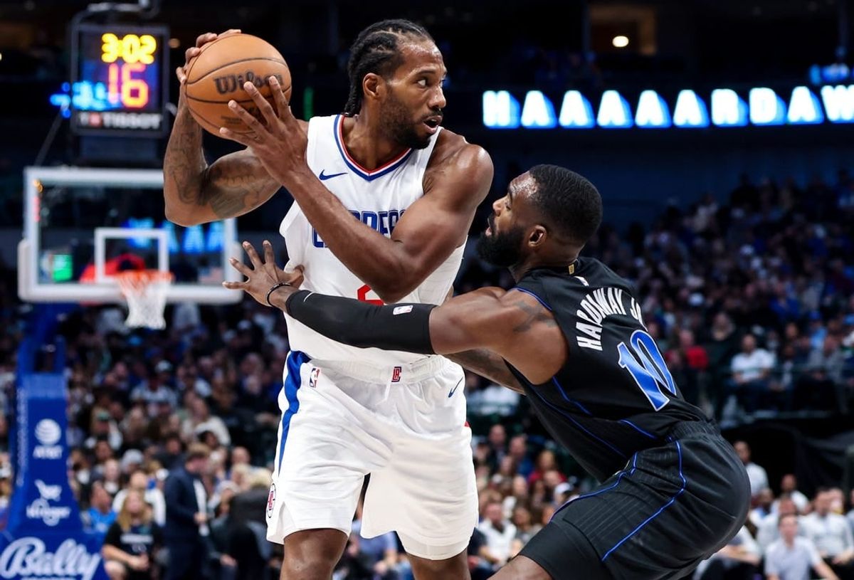 Nov 10, 2023; Dallas, Texas, USA;  LA Clippers forward Kawhi Leonard (2) looks to pass as Dallas Mavericks forward Tim Hardaway Jr. (10) defends  during the second half at American Airlines Center.