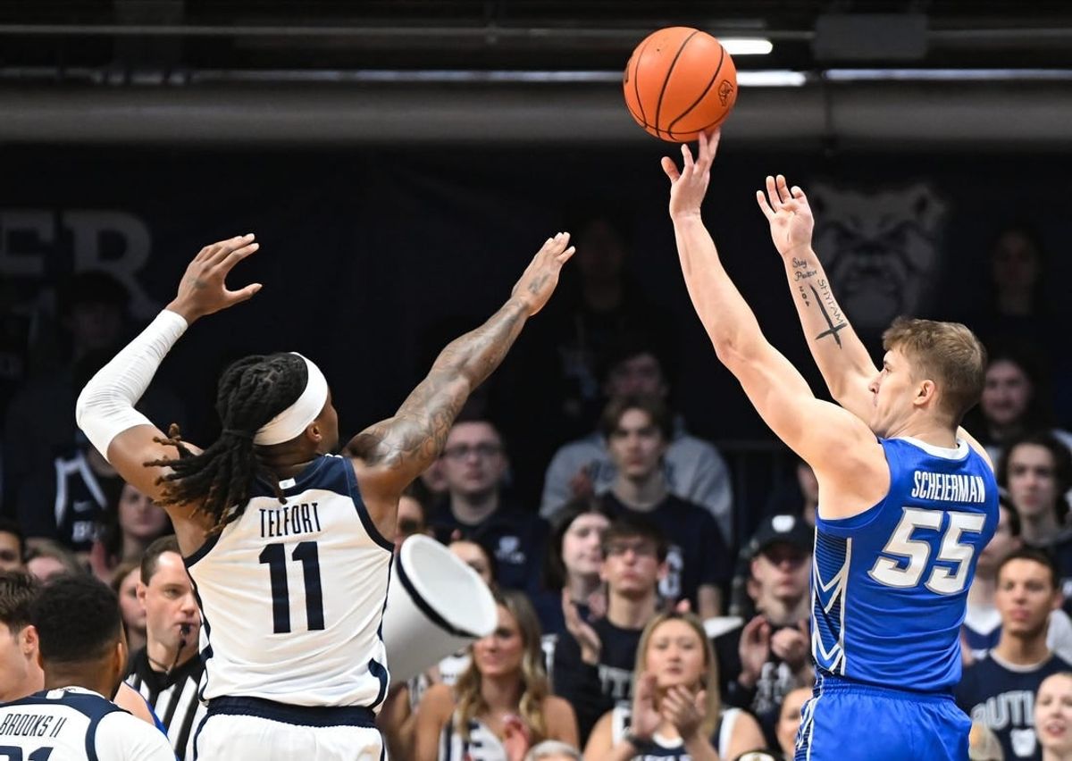 Feb 17, 2024; Indianapolis, Indiana, USA;  Creighton Bluejays guard Baylor Scheierman (55) attempts a shot over Butler Bulldogs guard Jahmyl Telfort (11) during the first half at Hinkle Fieldhouse.