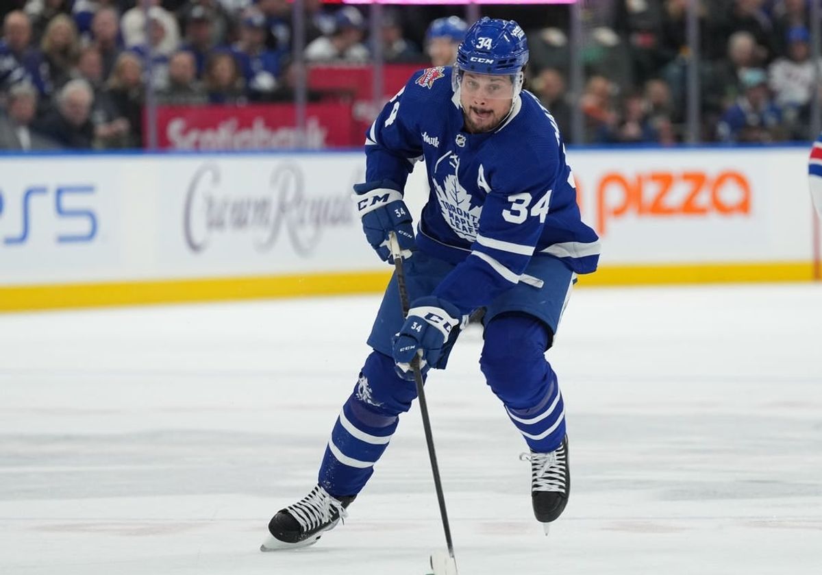 Dec 19, 2023; Toronto, Ontario, CAN; Toronto Maple Leafs center Auston Matthews (34) skates with the puck against the New York Rangers during the first period at Scotiabank Arena.