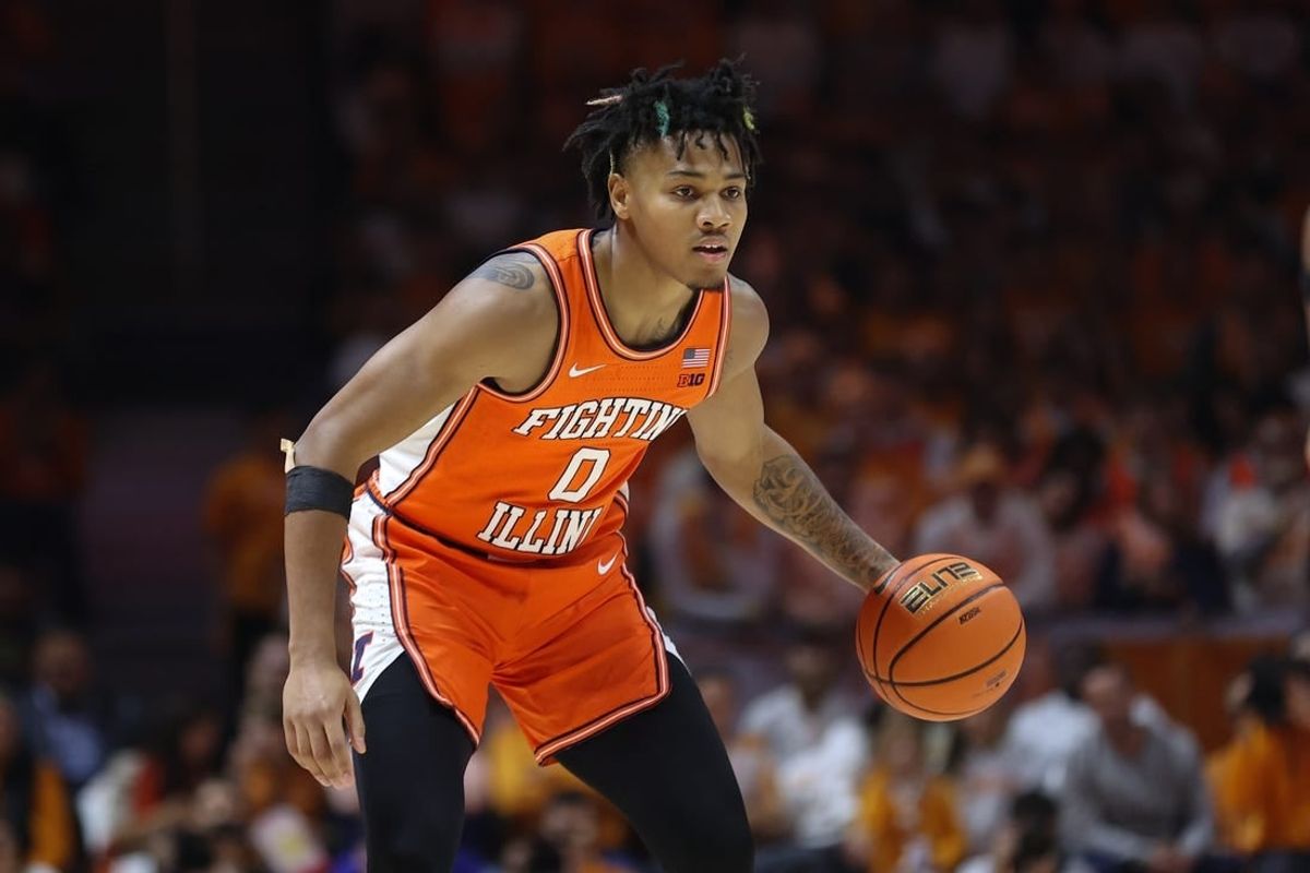 Dec 9, 2023; Knoxville, Tennessee, USA; Illinois Fighting Illini guard Terrence Shannon Jr. (0) brings the ball up court against the Tennessee Volunteers during the first half at Food City Center at Thompson Boling Arena.