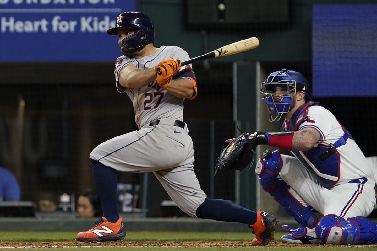 Apr 6, 2024; Arlington, Texas, USA; Houston Astros second base Jose Altuve (27) follows through on a single during the fourth inning against the Texas Rangers at Globe Life Field.