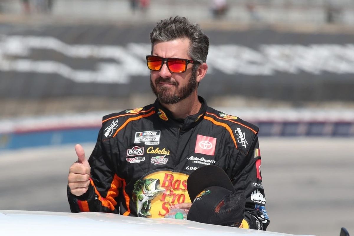 Sep 24, 2023; Fort Worth, Texas, USA;  NASCAR Cup Series driver  Martin Truex Jr. (19) during driver introductions before the AutoTrader EcoPark Automotive 400 at Texas Motor Speedway.