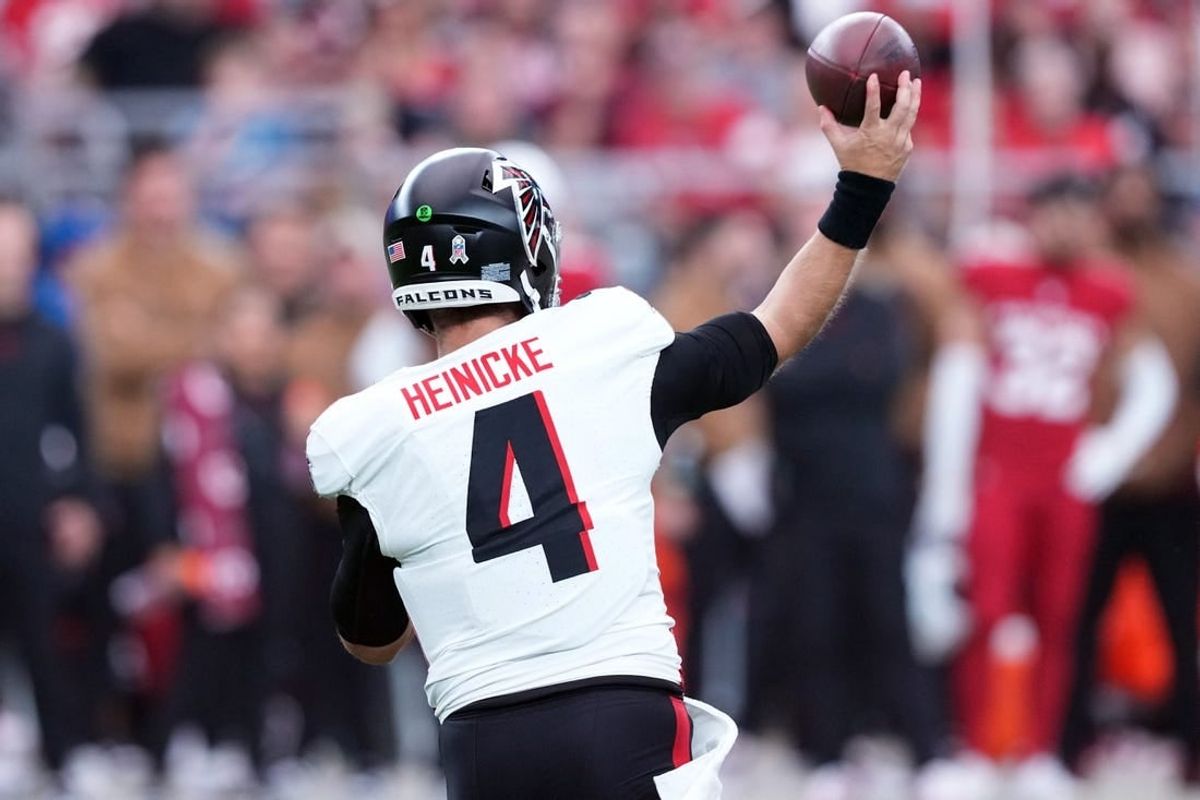Nov 12, 2023; Glendale, Arizona, USA; Atlanta Falcons quarterback Taylor Heinicke (4) throws against the Arizona Cardinals during the first half at State Farm Stadium.