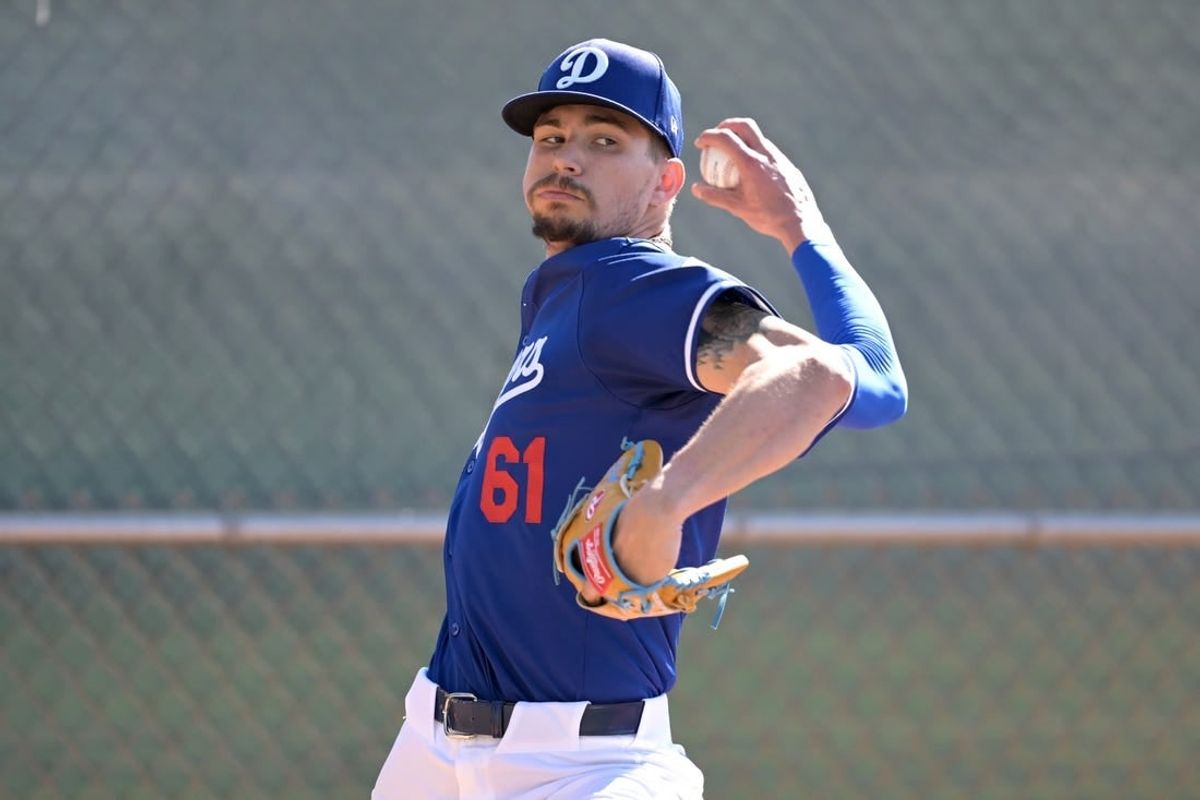 Feb 18, 2024; Glendale, AZ, USA;  Los Angeles Dodgers relief pitcher Ricky Vanasco (61) throws in the bullpen at spring training at Camelback Ranch.