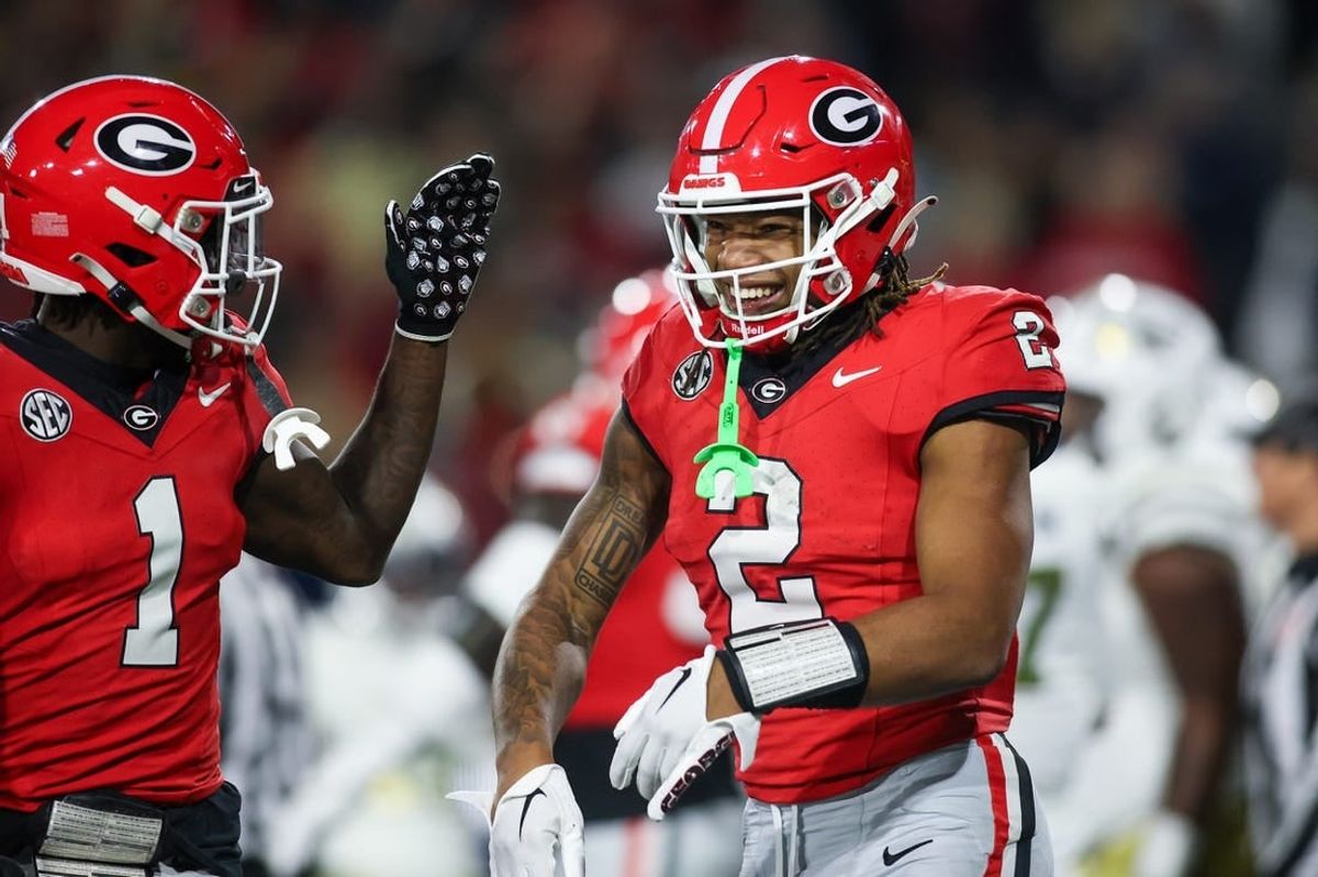 Nov 25, 2023; Atlanta, Georgia, USA; Georgia Bulldogs running back Kendall Milton (2) celebrates with wide receiver Marcus Rosemy-Jacksaint (1) after a touchdown against the Georgia Tech Yellow Jackets in the second quarter at Bobby Dodd Stadium at Hyundai Field.