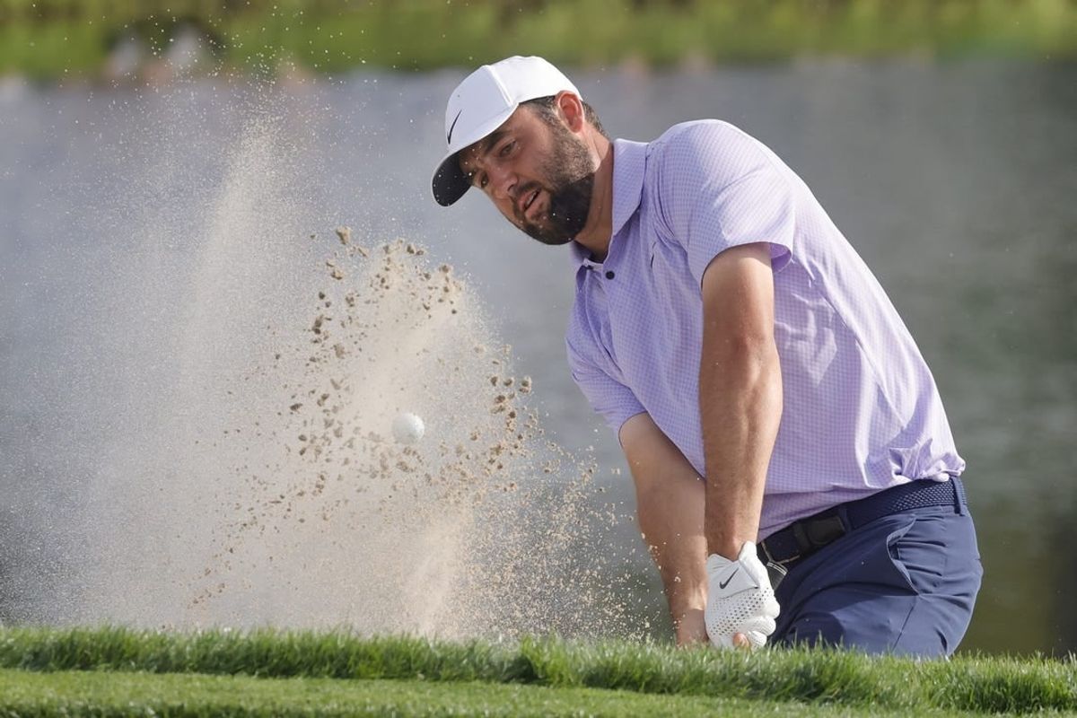 Mar 10, 2024; Orlando, Florida, USA;  Scottie Scheffler hits from the bunker on the 17th hole during the final round of the Arnold Palmer Invitational golf tournament.