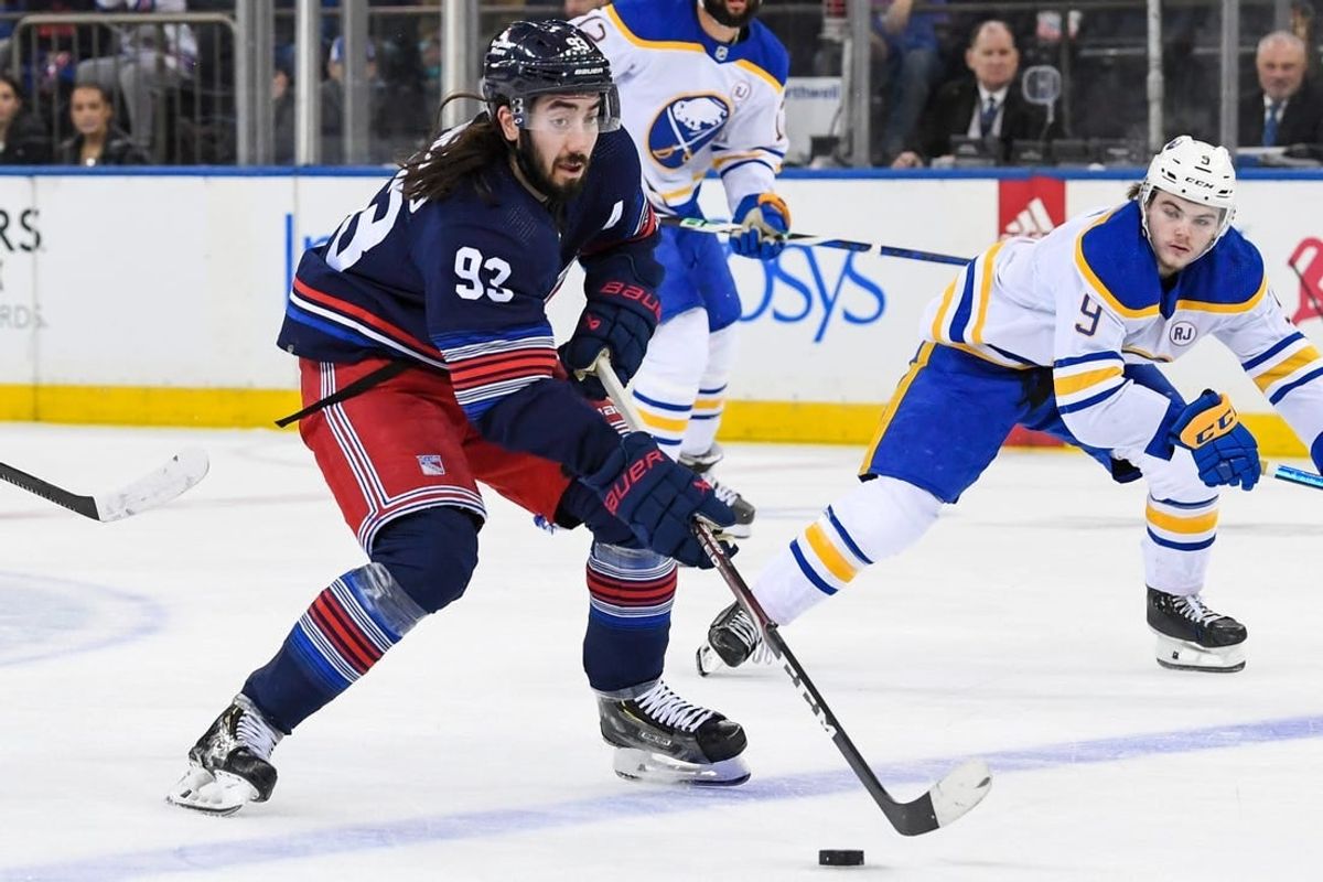 Dec 23, 2023; New York, New York, USA; New York Rangers center Mika Zibanejad (93) skates across the blue line against the Buffalo Sabres during the first period at Madison Square Garden.