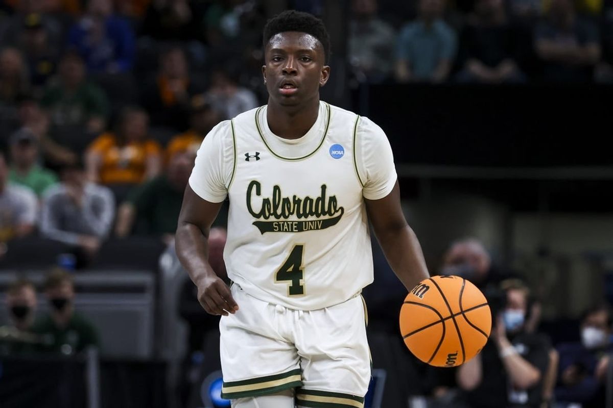 Mar 17, 2022; Indianapolis, IN, USA; Colorado State Rams guard Isaiah Stevens (4) controls the ball against the Michigan Wolverines in the first half during the first round of the 2022 NCAA Tournament at Gainbridge Fieldhouse.