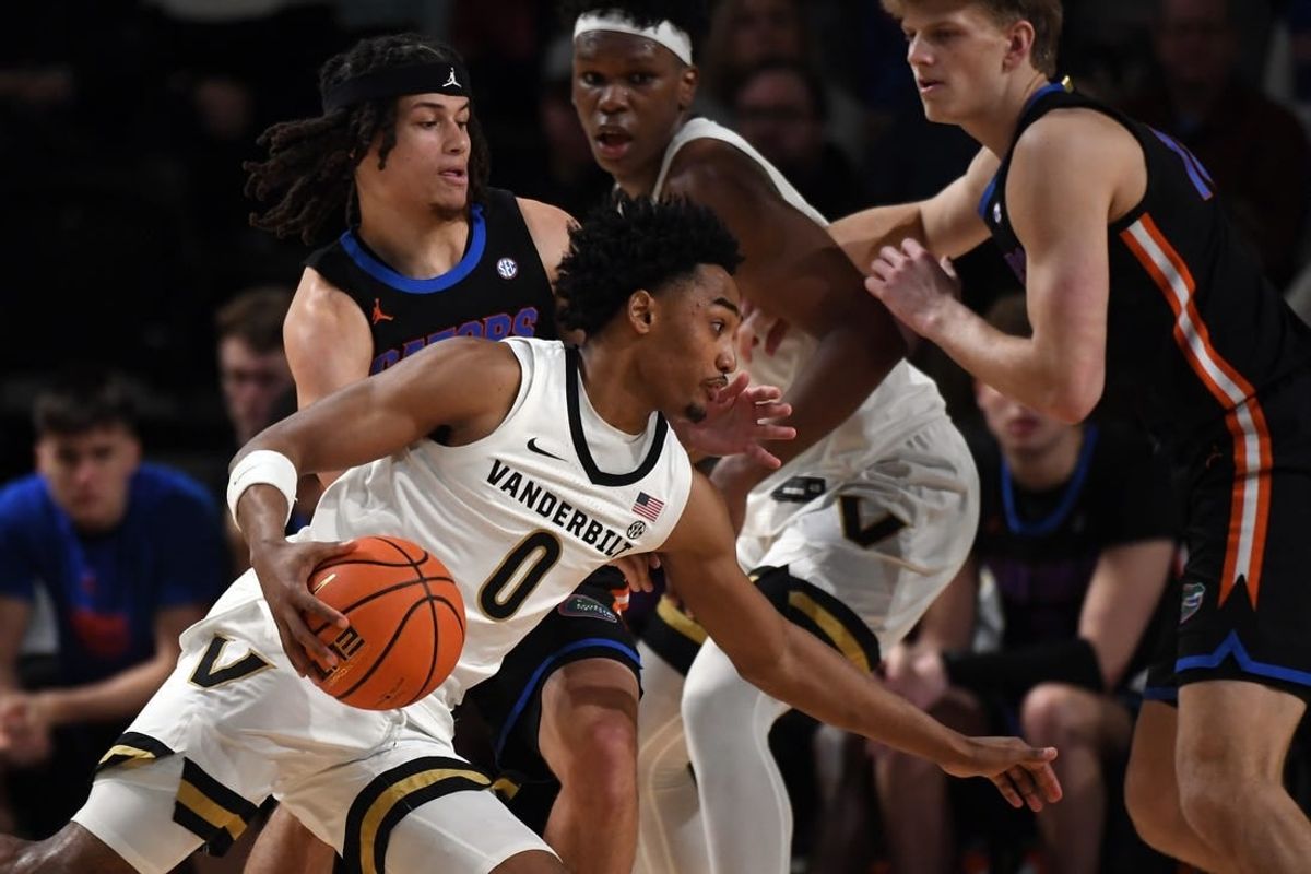 Mar 9, 2024; Nashville, Tennessee, USA; Vanderbilt Commodores guard Tyrin Lawrence (0) drives to the basket against Florida Gators guard Walter Clayton Jr. (1) during the first half at Memorial Gymnasium.