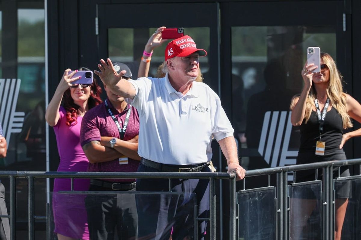 Aug 13, 2023; Bedminster, New Jersey, USA; Former President Donald Trump waves to the fans during the final round of the LIV Golf Bedminster golf tournament at Trump National Bedminster.