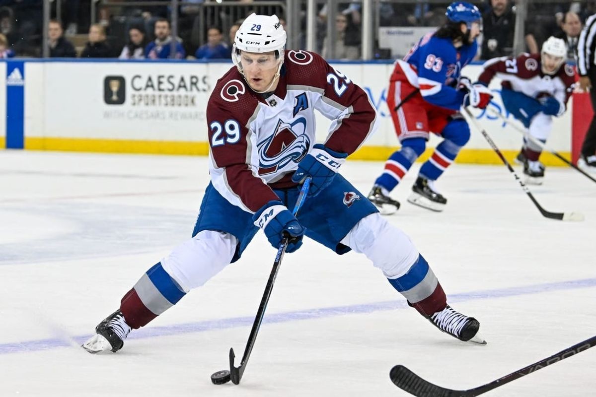 Feb 5, 2024; New York, New York, USA;  Colorado Avalanche center Nathan MacKinnon (29) skates with the puck against the New York Rangers during the second period at Madison Square Garden.
