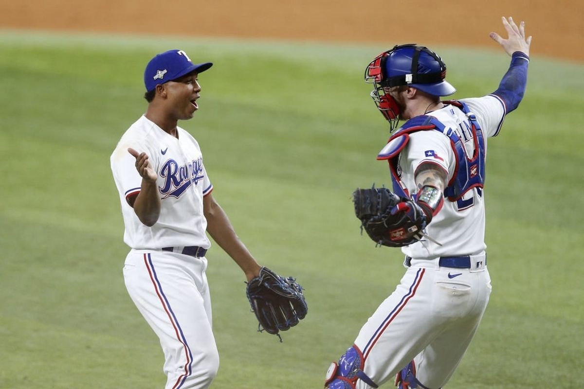 Oct 10, 2023; Arlington, Texas, USA; Texas Rangers relief pitcher Jose Leclerc (25) and catcher Jonah Heim (28) celebrate after defeating the Baltimore Orioles in game three of the ALDS for the 2023 MLB playoffs at Globe Life Field.