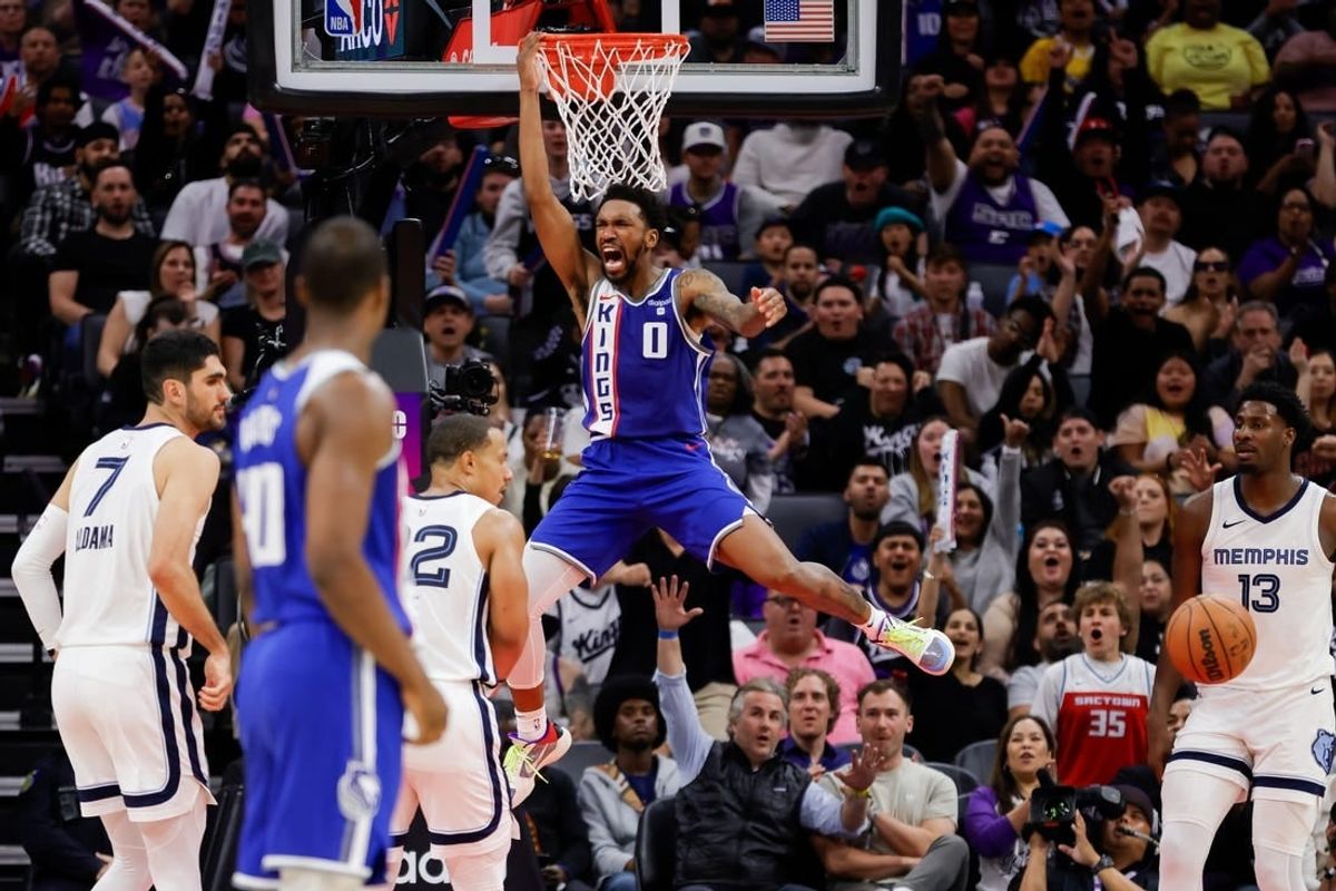 Mar 18, 2024; Sacramento, California, USA; Sacramento Kings guard Malik Monk (0) dunks the ball during the fourth quarter against the Memphis Grizzlies at Golden 1 Center.