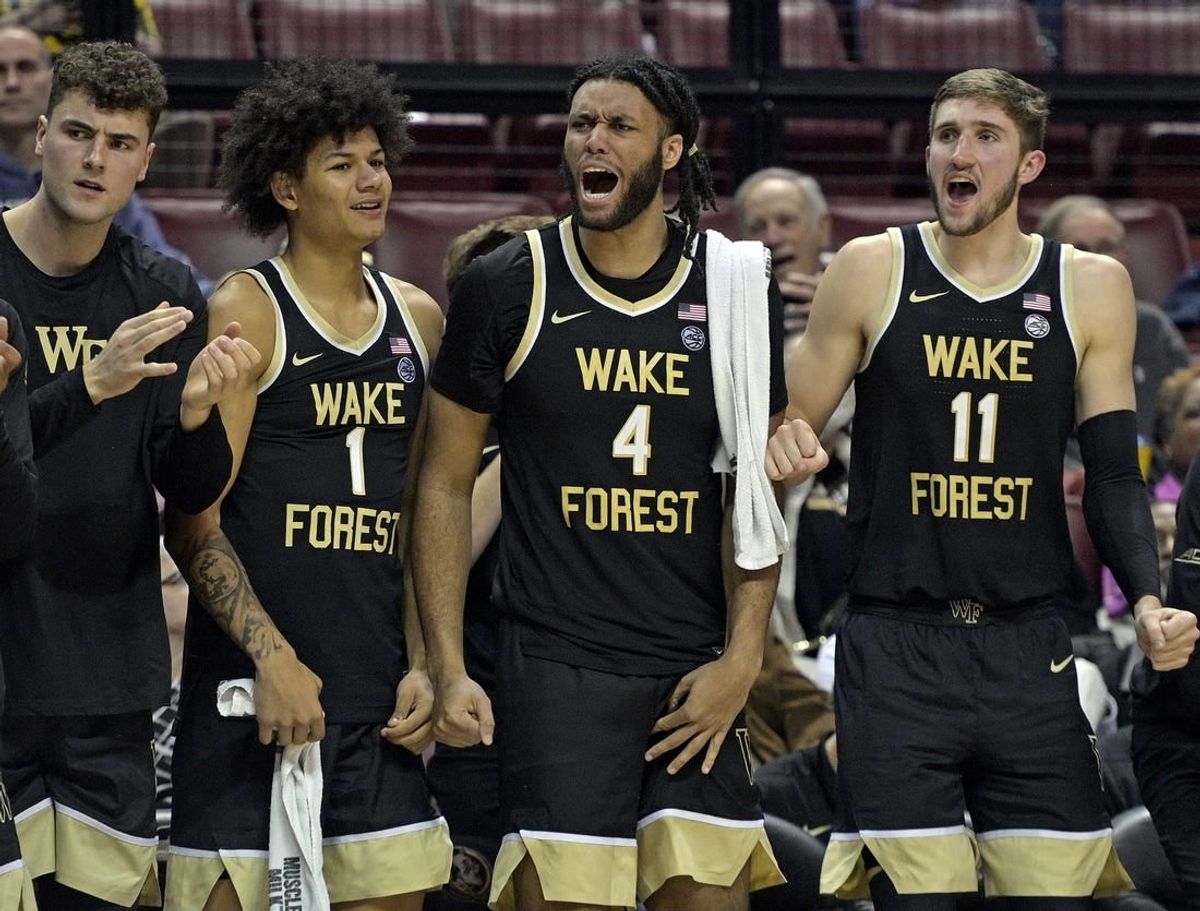 Jan 9, 2024; Tallahassee, Florida, USA; Wake Forest Demon Deacons forwards Marqus Marion (1), Efton Reid III (4), and Andrew Carr (11) react during the second half against the Florida State Seminoles at Donald L. Tucker Center.