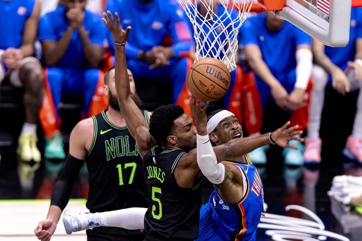Apr 29, 2024; New Orleans, Louisiana, USA; Oklahoma City Thunder guard Shai Gilgeous-Alexander (2) drives to the basket against New Orleans Pelicans forward Herbert Jones (5) during game four of the first round for the 2024 NBA playoffs at Smoothie King Center.