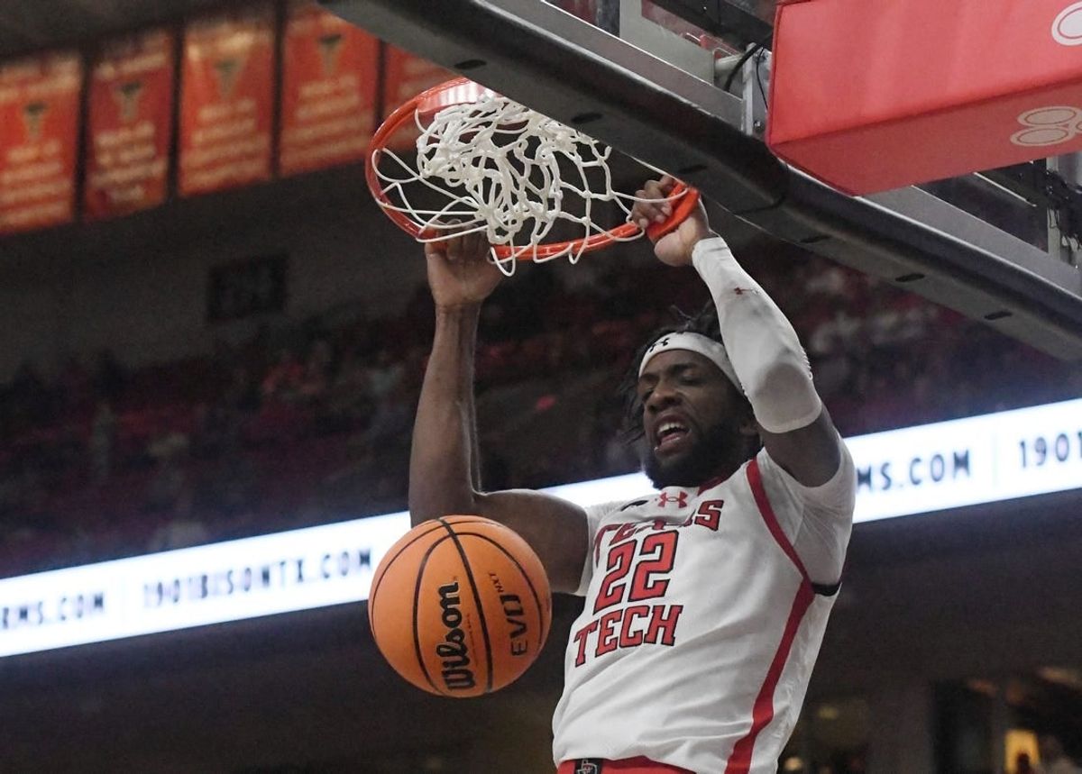 Texas Tech's forward Warren Washington (22) dunks the ball against Texas A&M-Commerce in the first home game of the season, Wednesday, Nov. 8, 2023, at United Supermarkets Arena.