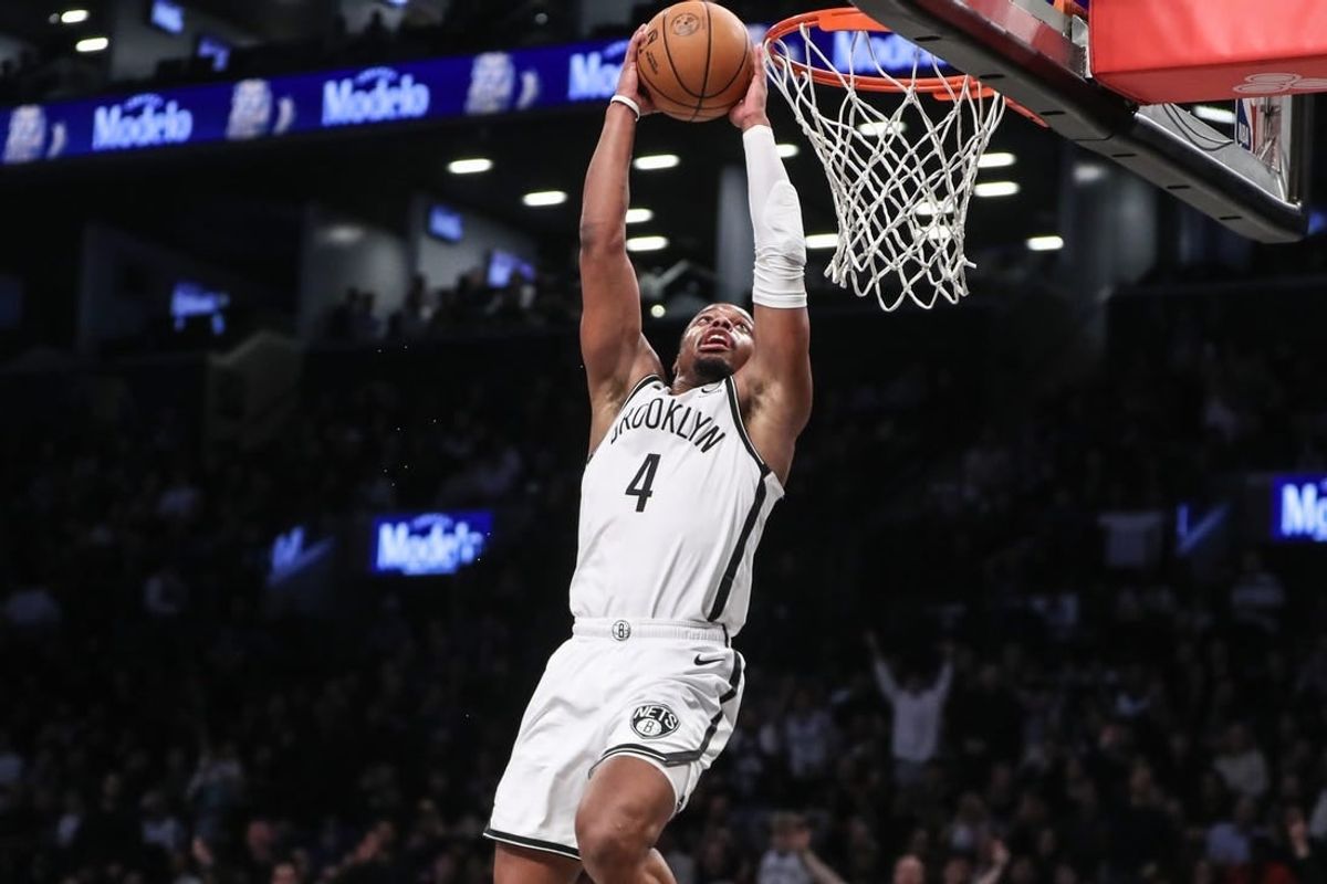 Mar 5, 2024; Brooklyn, New York, USA;  Brooklyn Nets guard Dennis Smith Jr. (4) goes up for a dunk in the fourth quarter against the Philadelphia 76ers at Barclays Center.