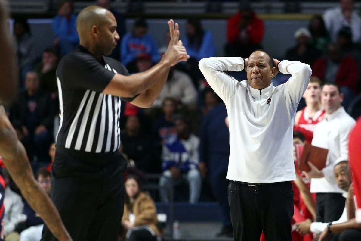 Nov 28, 2023; Oxford, Mississippi, USA; North Carolina State Wolfpack head coach Kevin Keatts (right) reacts to a foul call during the second half  against the Mississippi Rebels at The Sandy and John Black Pavilion at Ole Miss.