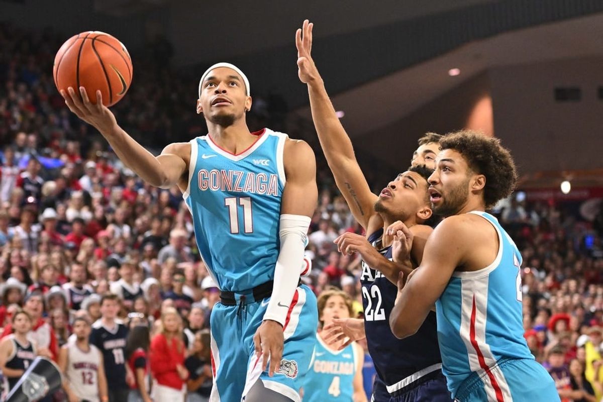 Nov 10, 2023; Spokane, Washington, USA; Gonzaga Bulldogs guard Nolan Hickman (11) shoots the ball against Yale Bulldogs forward Matt Knowling (22) in the first half at McCarthey Athletic Center.