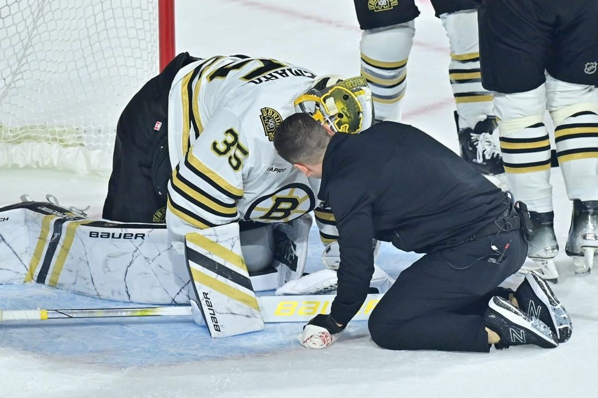 Jan 9, 2024; Tempe, Arizona, USA; Boston Bruins goaltender Linus Ullmark (35) is checked by an athletic trainer during overtime against the Arizona Coyotes at Mullett Arena.