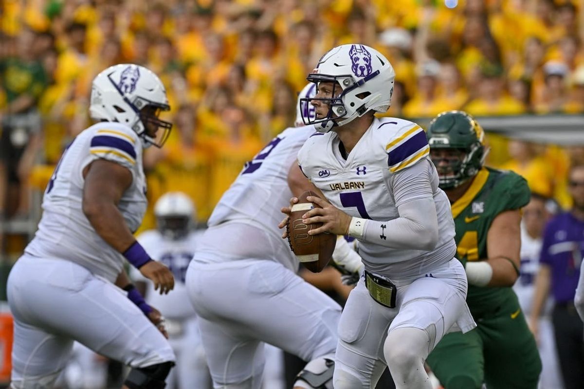 Sep 3, 2022; Waco, Texas, USA; Albany Great Danes quarterback Reese Poffenbarger (7) runs with the ball against the Baylor Bears during the first quarter at McLane Stadium.