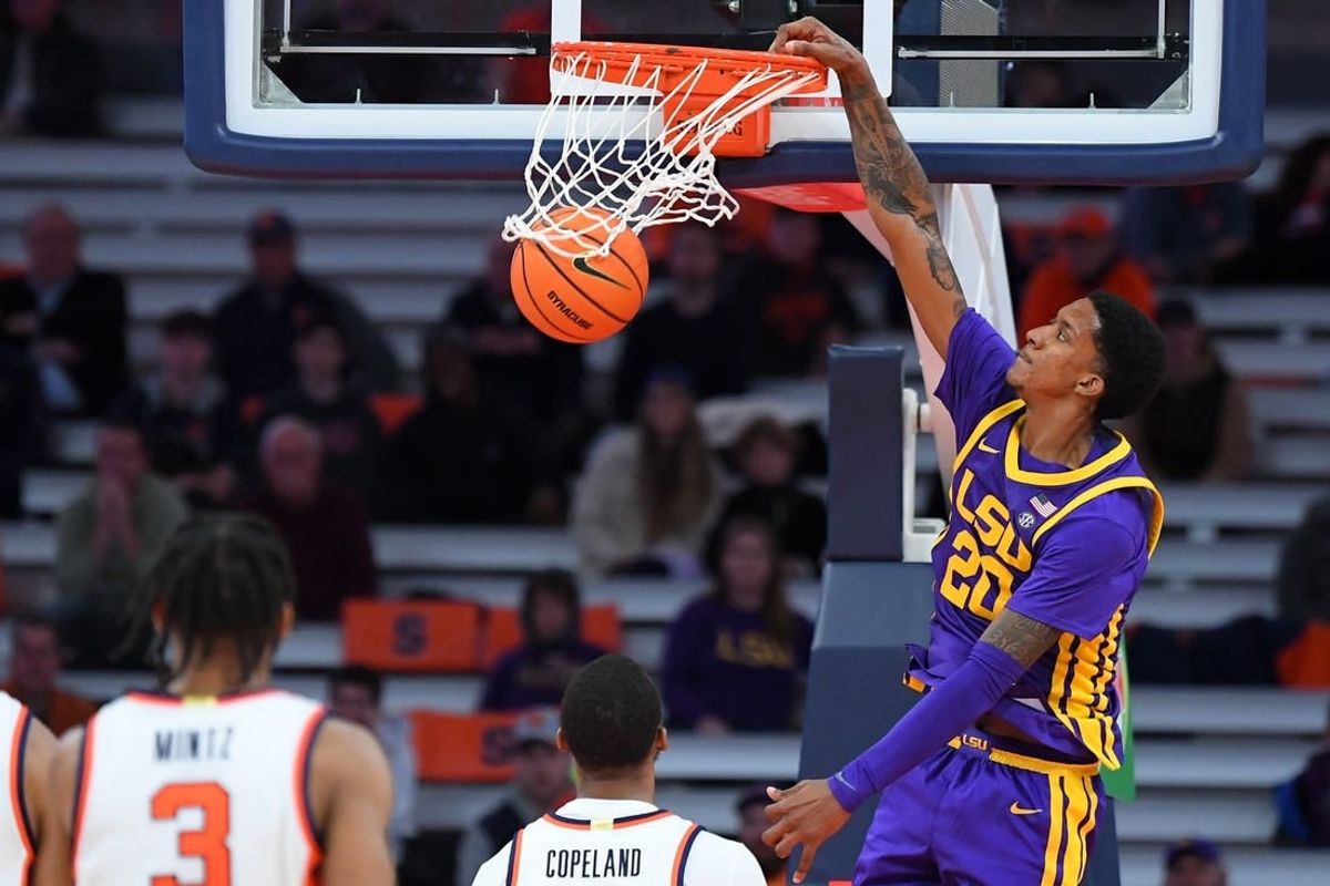 Nov 28, 2023; Syracuse, New York, USA; LSU Tigers forward Derek Fountain (20) dunks the ball against the Syracuse Orange during the second half at the JMA Wireless Dome.