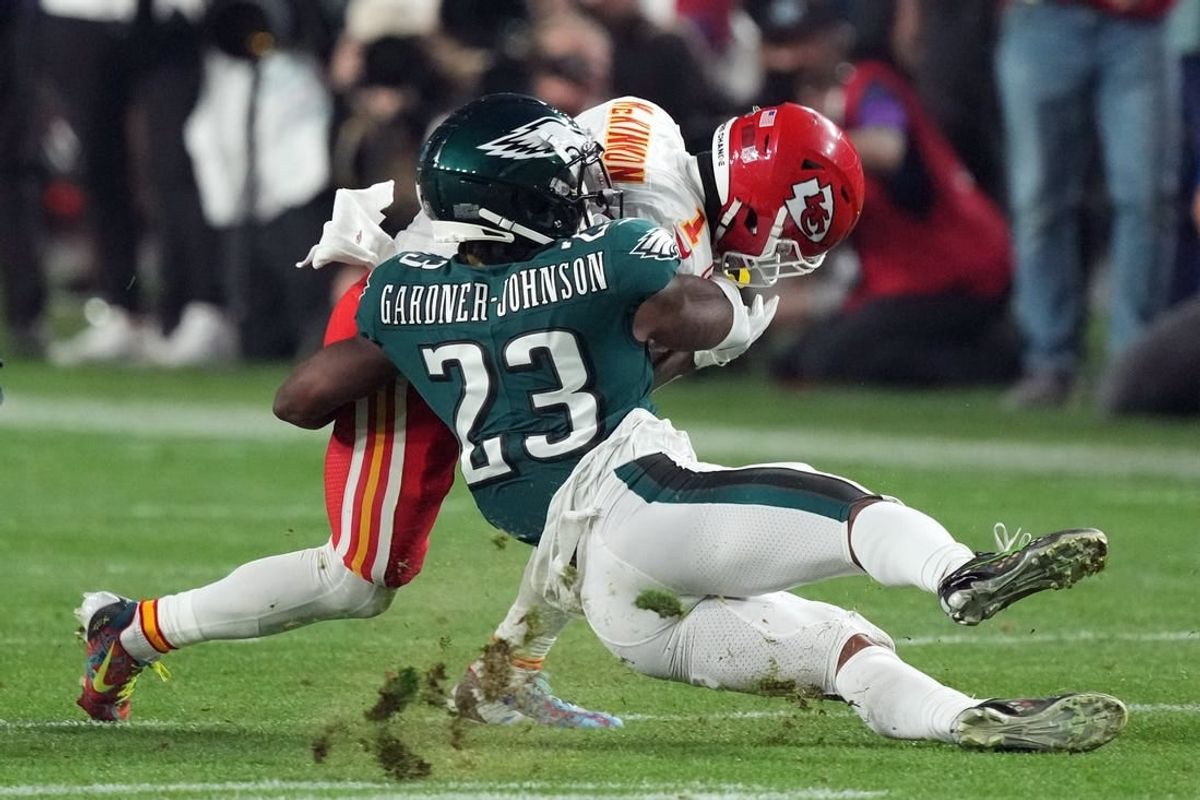 Feb 12, 2023; Glendale, Arizona, US; Philadelphia Eagles safety C.J. Gardner-Johnson (23) tackles Kansas City Chiefs running back Jerick McKinnon (1) in the third quarter of Super Bowl LVII at State Farm Stadium.