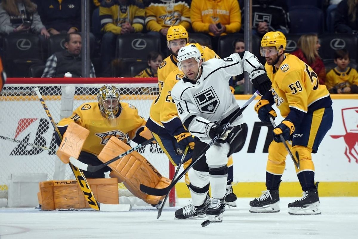 Jan 31, 2024; Nashville, Tennessee, USA; Los Angeles Kings center Trevor Lewis (61) chases down a loose puck during the first period against the Nashville Predators at Bridgestone Arena.