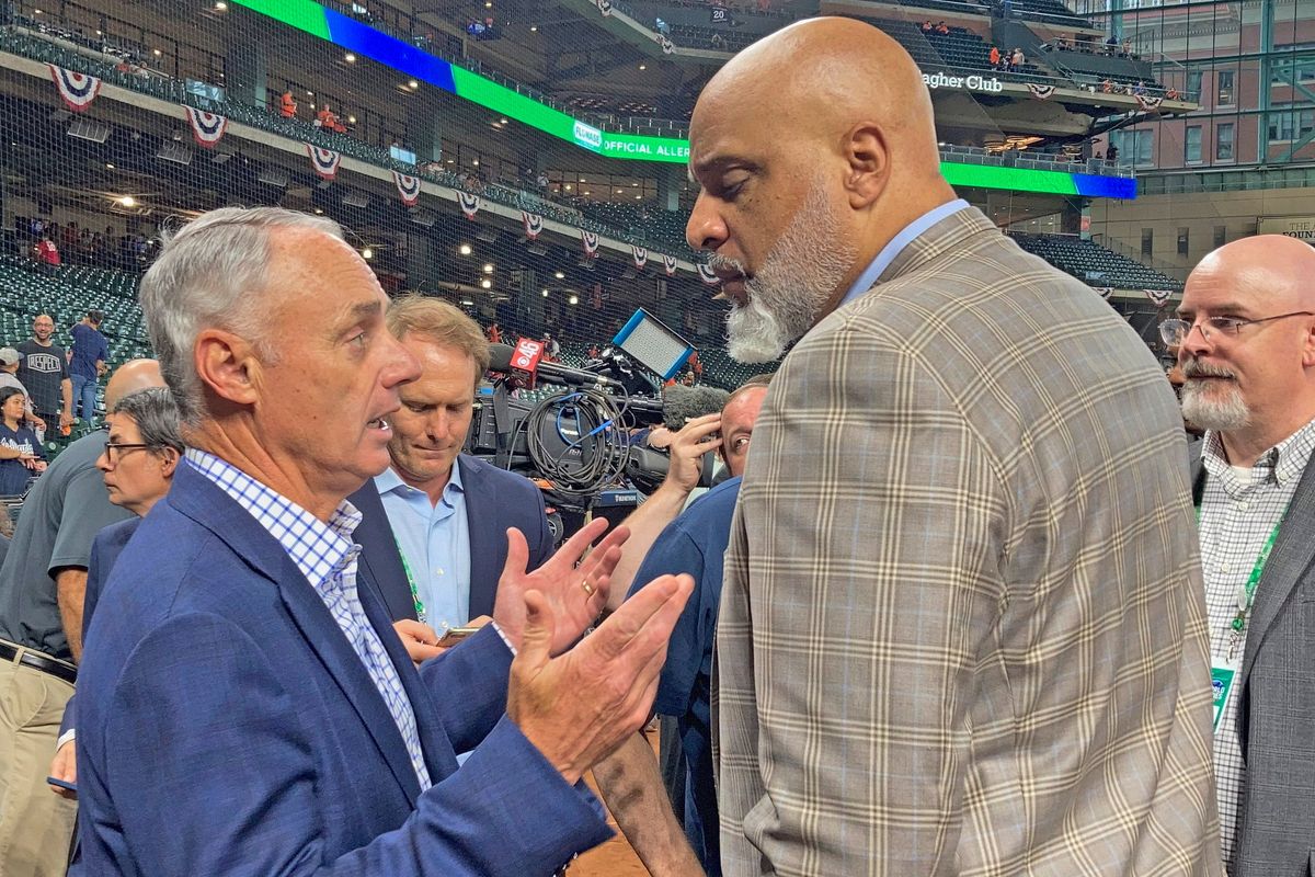 Baseball commissioner Rob Manfred, left, and MLBPA president Tony Clark.
