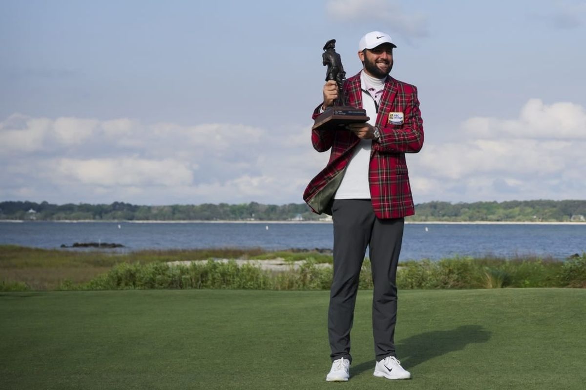 Apr 22, 2024; Hilton Head, South Carolina, USA; Scottie Scheffler poses for a photo with the trophy after winning the RBC Heritage golf tournament. Play was suspended on Sunday, due to inclement weather.