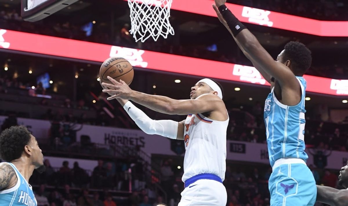 Jan 29, 2024; Charlotte, North Carolina, USA;  New York Knicks guard Josh Hart (3) moves in past Charlotte Hornets forward guard Brandon Miller (24) during the first half at the Spectrum Center.