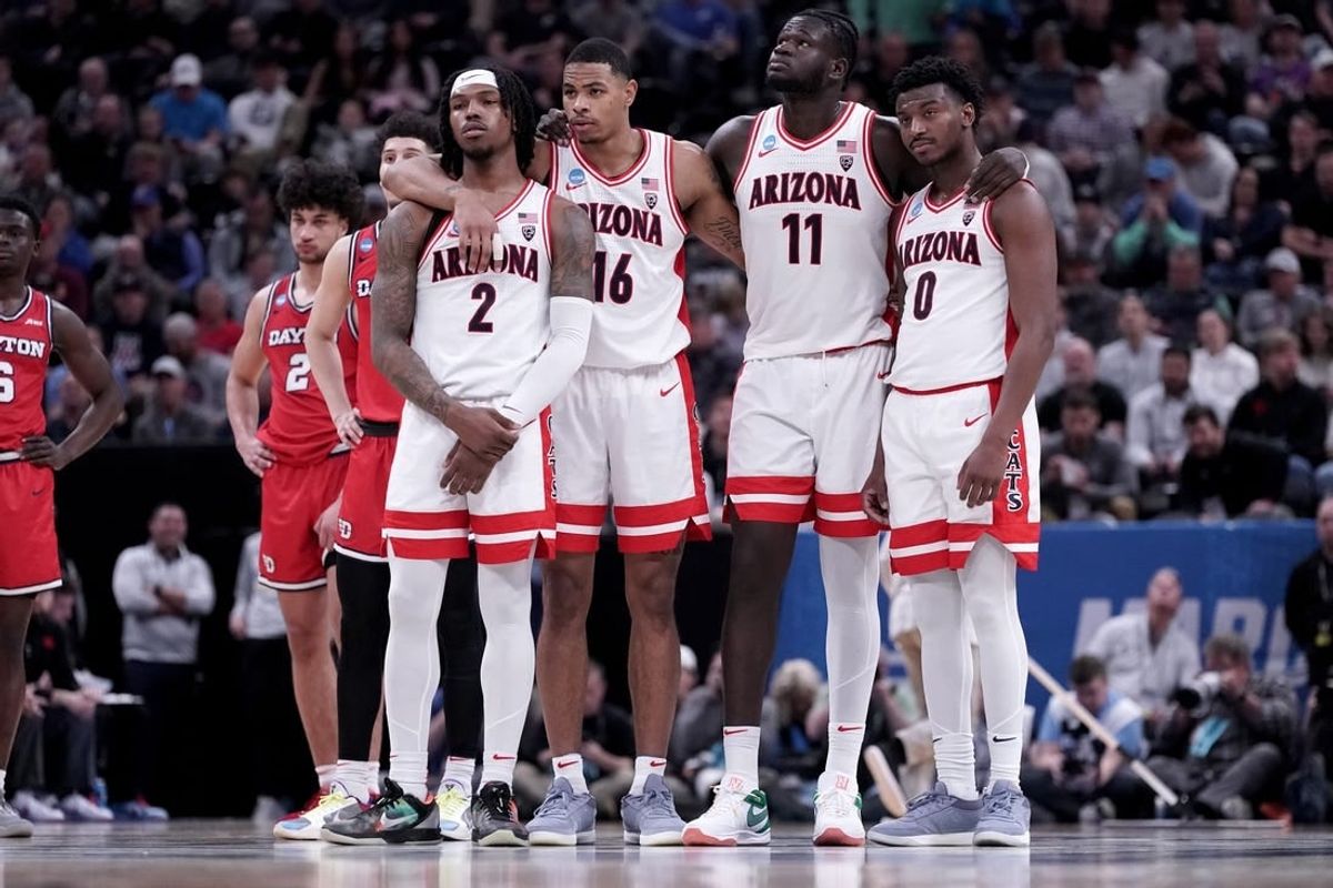 Mar 23, 2024; Salt Lake City, UT, USA; Arizona Wildcats guard Caleb Love (2), forward Keshad Johnson (16), center Oumar Ballo (11) and guard Jaden Bradley (0) watch a technical free throw during the second half in the second round of the 2024 NCAA Tournament against the Dayton Flyers at Vivint Smart Home Arena-Delta Center.