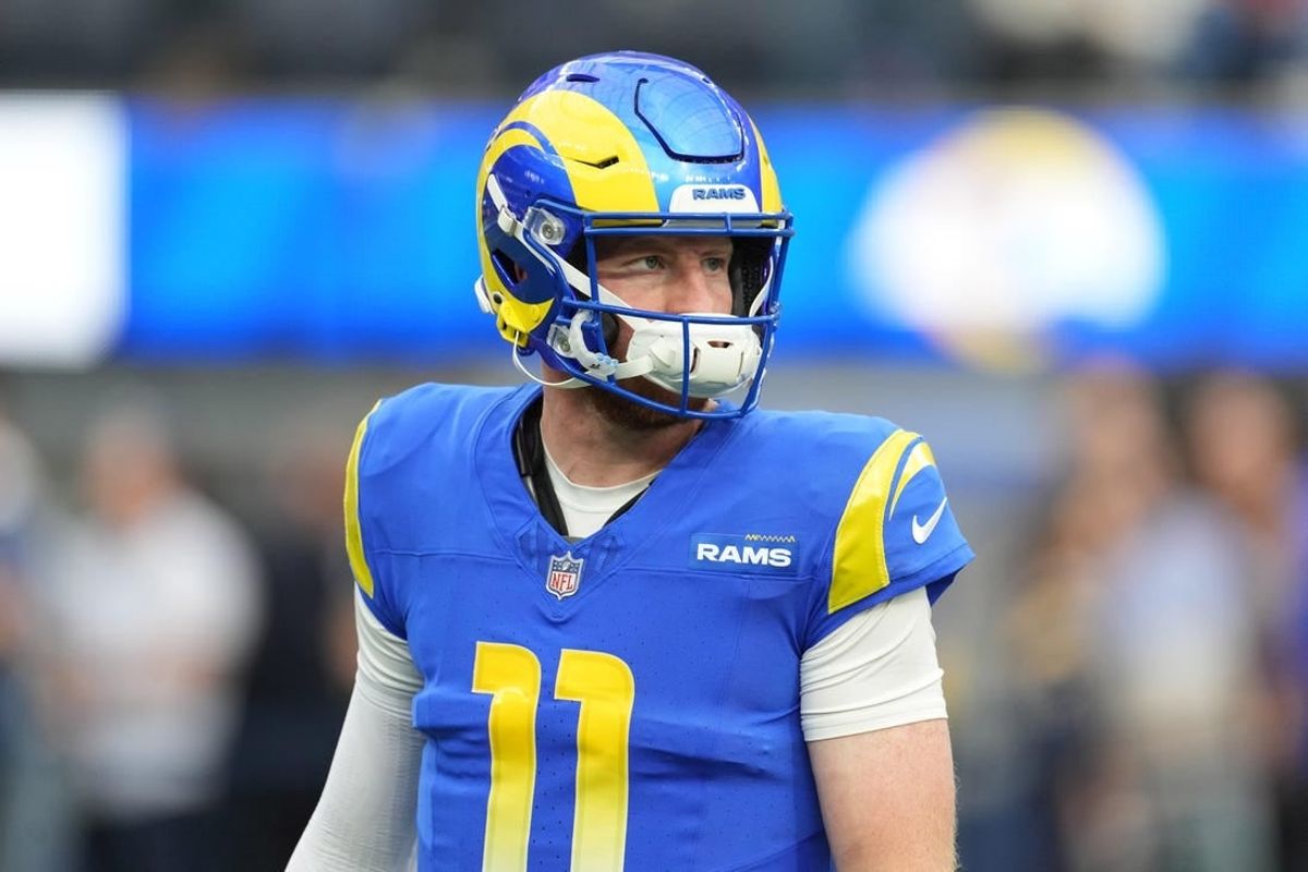 Dec 17, 2023; Inglewood, California, USA; Los Angeles Rams quarterback Carson Wentz (11) reacts during the first half against the Washington Commanders at SoFi Stadium.