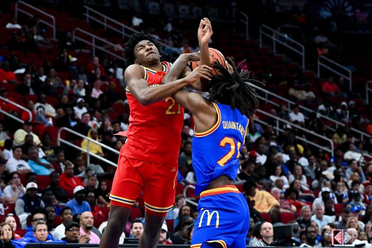 Apr 2, 2024; Houston, TX, USA; McDonald's All American East forward Jayden Quaintance (21) fouls McDonald's All American West guard Karter Knox (21) during the second half at Toyota Center.