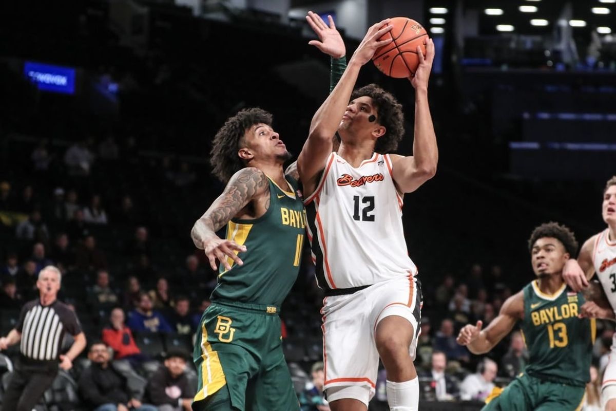 Nov 22, 2023; Brooklyn, NY, USA; Oregon State Beavers forward Michael Rataj (12) looks to drive past Baylor Bears forward Jalen Bridges (11) in the first half at Barclay Center.