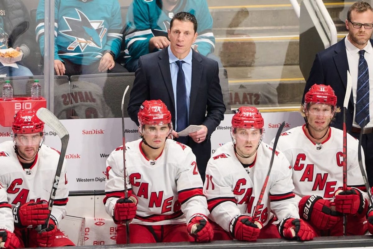 Oct 17, 2023; San Jose, California, USA; Carolina Hurricanes head coach Rod Brind'Amour watches the game from behind the bench against the San Jose Sharks during the third period at SAP Center at San Jose.