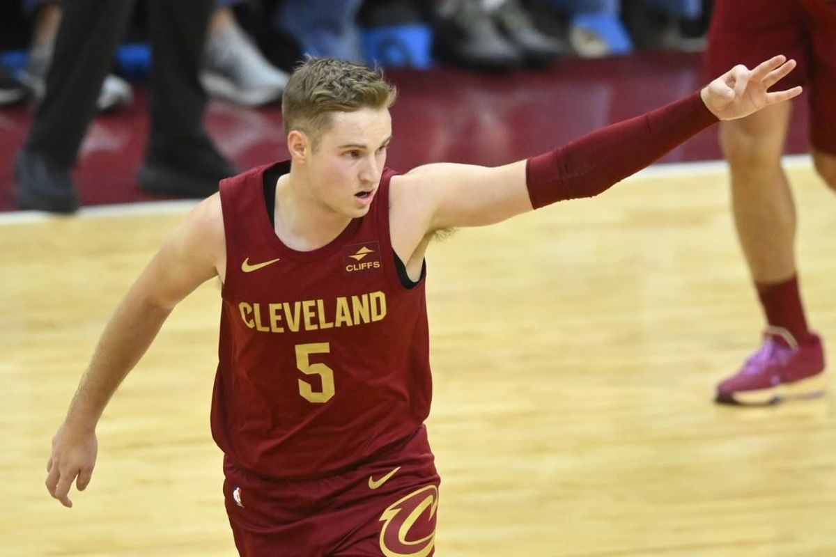 Dec 20, 2023; Cleveland, Ohio, USA; Cleveland Cavaliers guard Sam Merrill (5) celebrates his three-point basket in the fourth quarter against the Utah Jazz at Rocket Mortgage FieldHouse.