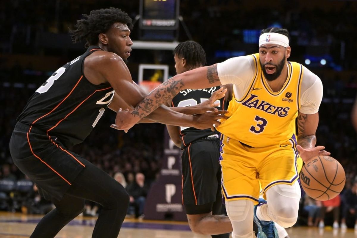 Feb 13, 2024; Los Angeles, California, USA;  Los Angeles Lakers forward Anthony Davis (3) is defended by Detroit Pistons center James Wiseman (13) in the first half at Crypto.com Arena.