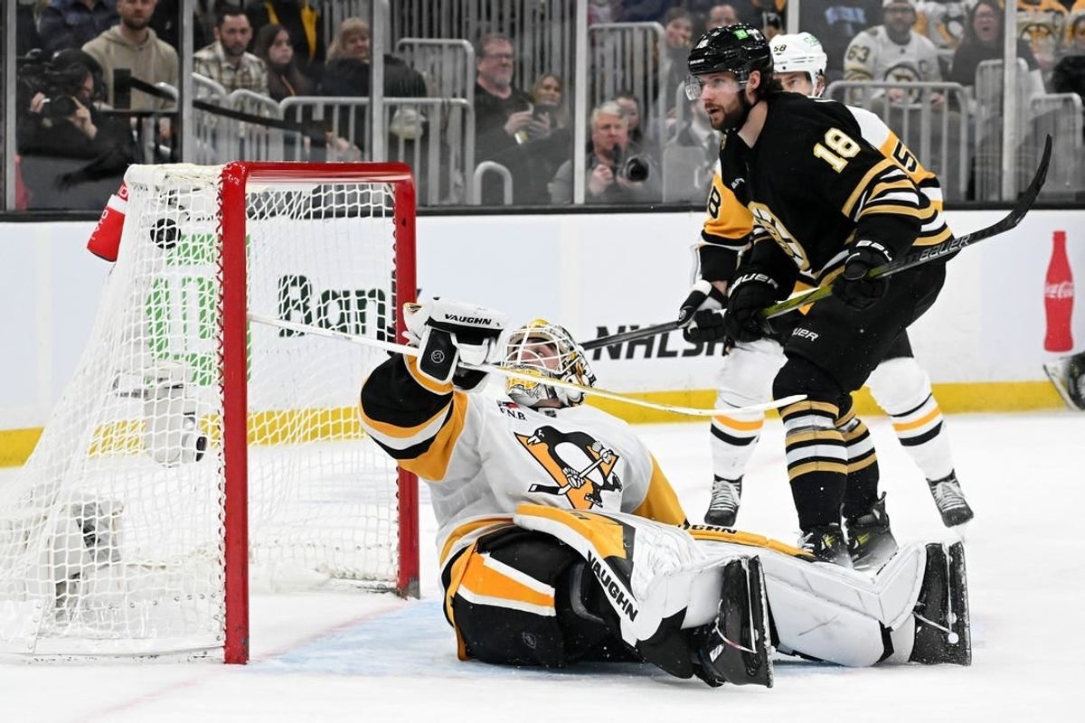 Mar 9, 2024; Boston, Massachusetts, USA; Boston Bruins center Pavel Zacha (18) scores on Pittsburgh Penguins goaltender Alex Nedeljkovic (39) during the third period at the TD Garden.