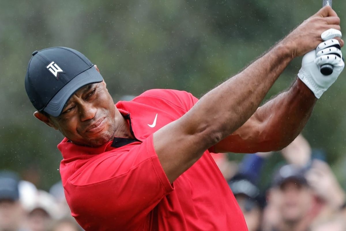 Dec 17, 2023; Orlando, Florida, USA;  Tiger Woods plays his shot from the first tee during the PNC Championship at The Ritz-Carlton Golf Club.