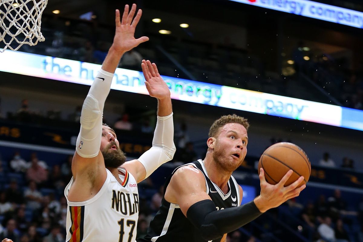 Blake Griffin (r., with silly facial expression)