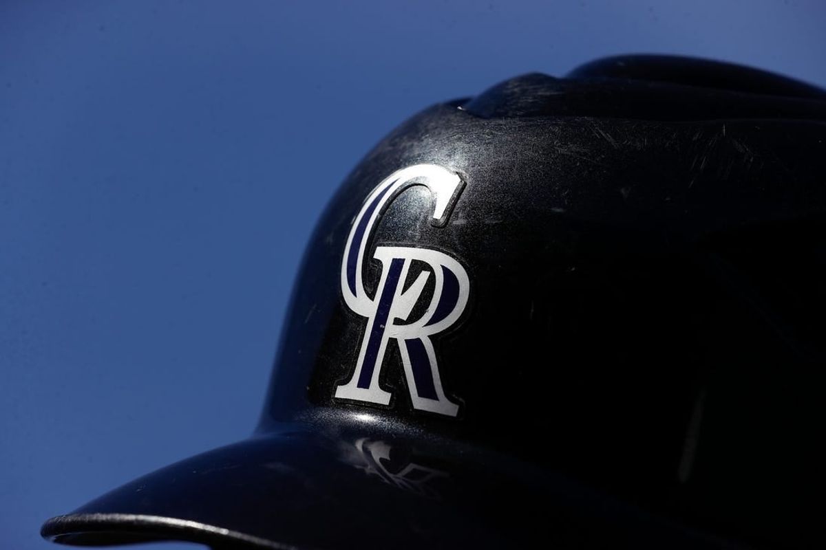 Aug 20, 2023; Denver, Colorado, USA; A detail view of a Colorado Rockies batting helmet in the seventh inning against the Chicago White Sox at Coors Field.