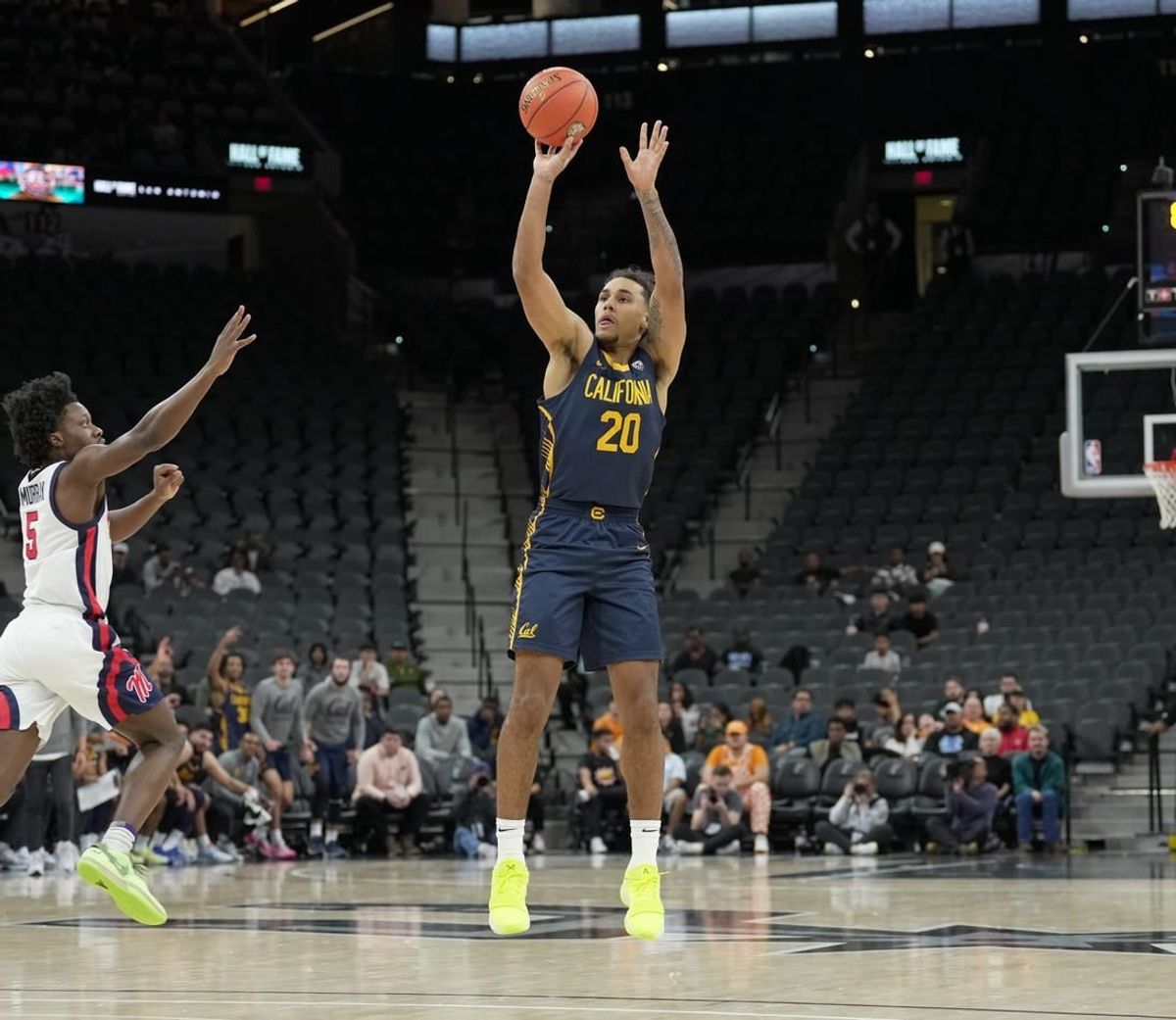 Dec 16, 2023; San Antonio, Texas, USA; California Golden Bears guard Jaylon Tyson (20) shoots in front of Mississippi Rebels guard Jaylen Murray (5) in the first half at the Frost Bank Center.