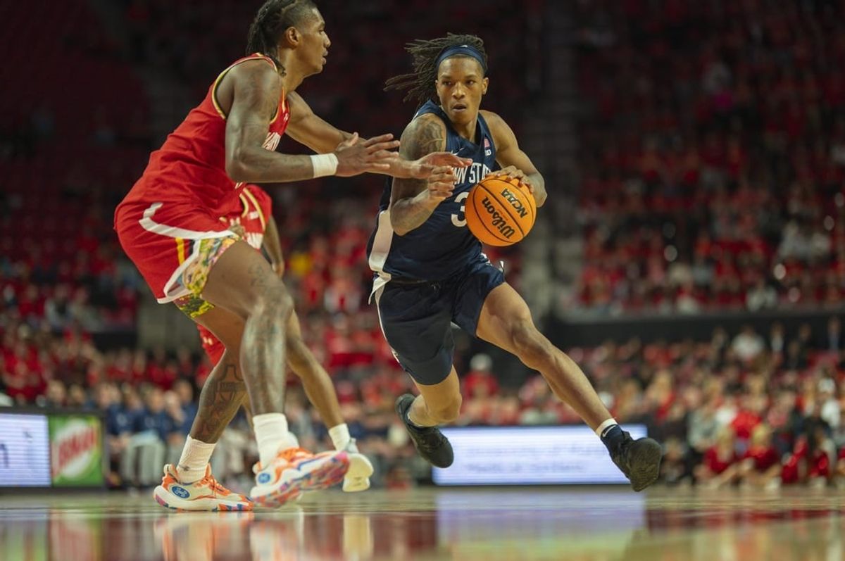 Dec 6, 2023; College Park, Maryland, USA;  Penn State Nittany Lions guard Nick Kern Jr. (3) dribble by Maryland Terrapins forward Julian Reese (10) during the first half at Xfinity Center.