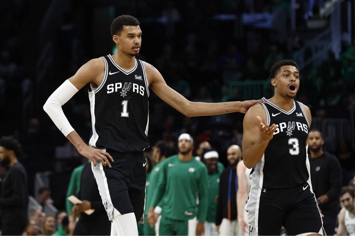 Jan 17, 2024; Boston, Massachusetts, USA; San Antonio Spurs center Victor Wembanyama (1) and forward Keldon Johnson (3) head for the bench during the second half of their game against the Boston Celtics at TD Garden.