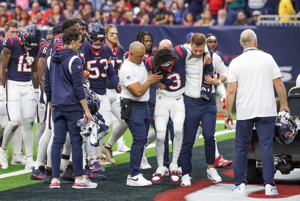 Dec 3, 2023; Houston, Texas, USA;  Trainers move an injured Houston Texans wide receiver Tank Dell (3) two the cart as he injured himself on a touchdown play against the Denver Broncos at NRG Stadium.