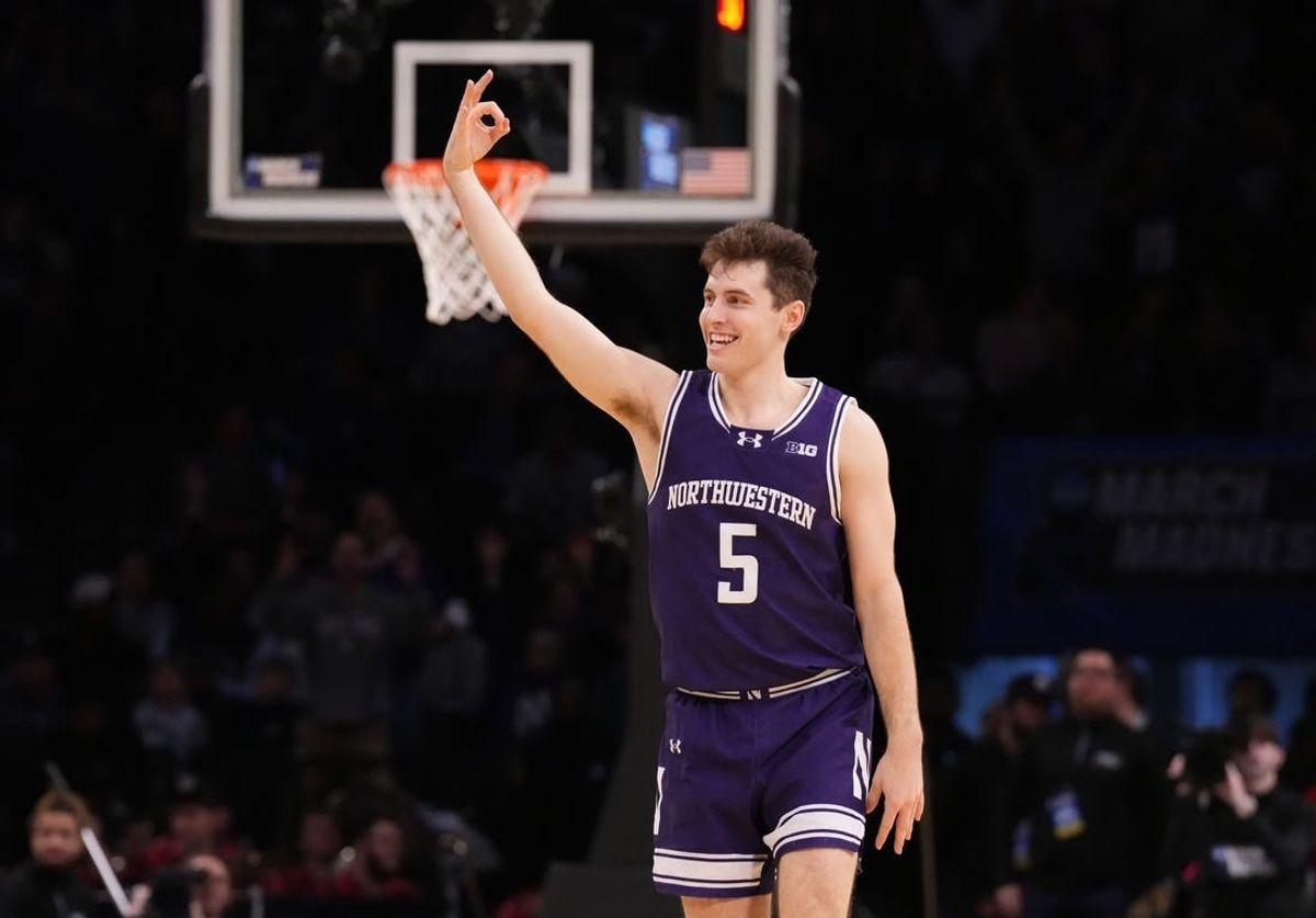 March 22, 2024, Brooklyn, NY, USA;  Northwestern Wildcats guard Ryan Langborg (5) reacts after a three pointer in overtime against the Florida Atlantic Owls in the first round of the 2024 NCAA Tournament at the Barclays Center.